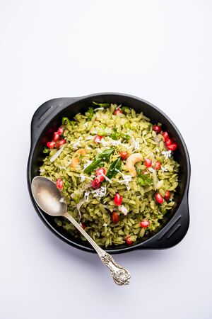 Hariyali Poha / Green Masala Pohe or flattened rice served in a bowl, selective focusの写真素材