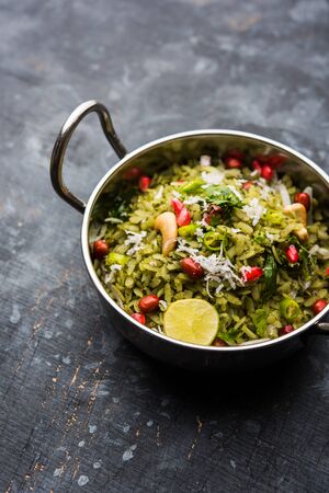 Hariyali Poha / Green Masala Pohe or flattened rice served in a bowl, selective focusの写真素材