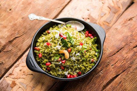 Hariyali Poha / Green Masala Pohe or flattened rice served in a bowl, selective focusの写真素材