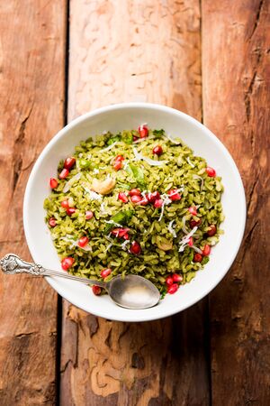 Hariyali Poha / Green Masala Pohe or flattened rice served in a bowl, selective focusの写真素材