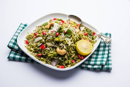 Hariyali Poha / Green Masala Pohe or flattened rice served in a bowl, selective focusの写真素材