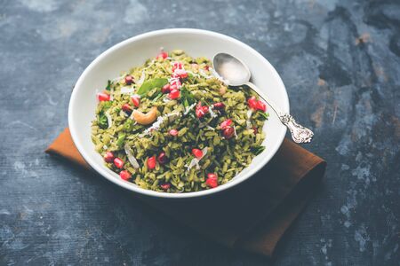Hariyali Poha / Green Masala Pohe or flattened rice served in a bowl, selective focusの写真素材