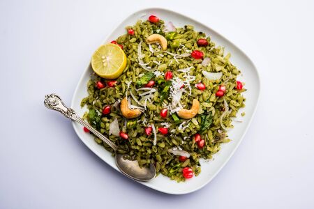 Hariyali Poha / Green Masala Pohe or flattened rice served in a bowl, selective focusの写真素材