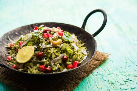 Hariyali Poha / Green Masala Pohe or flattened rice served in a bowl, selective focusの写真素材