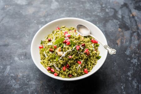 Hariyali Poha / Green Masala Pohe or flattened rice served in a bowl, selective focusの写真素材