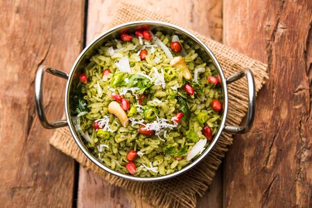 Hariyali Poha / Green Masala Pohe or flattened rice served in a bowl, selective focusの写真素材
