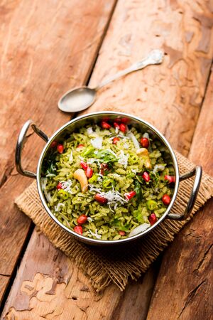 Hariyali Poha / Green Masala Pohe or flattened rice served in a bowl, selective focusの写真素材
