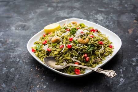 Hariyali Poha / Green Masala Pohe or flattened rice served in a bowl, selective focusの写真素材