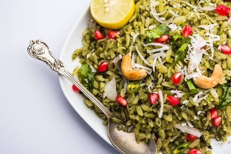 Hariyali Poha / Green Masala Pohe or flattened rice served in a bowl, selective focusの写真素材