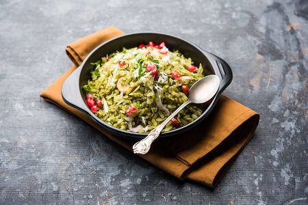 Hariyali Poha / Green Masala Pohe or flattened rice served in a bowl, selective focusの写真素材