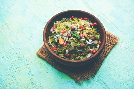 Hariyali Poha / Green Masala Pohe or flattened rice served in a bowl, selective focusの写真素材