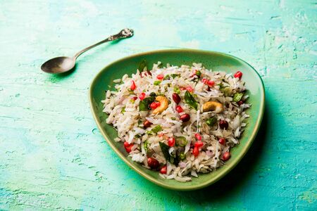 Dapde Pohe is a typical Maharashtrian breakfast, made with thin variety of poha and fresh coconut with chili, peanuts and nuts. served in a bowl or plate.の写真素材