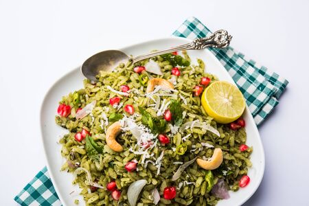 Hariyali Poha / Green Masala Pohe or flattened rice served in a bowl, selective focusの写真素材