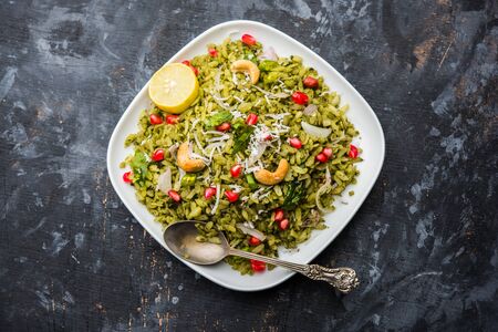 Hariyali Poha / Green Masala Pohe or flattened rice served in a bowl, selective focusの写真素材