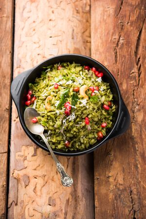 Hariyali Poha / Green Masala Pohe or flattened rice served in a bowl, selective focusの写真素材