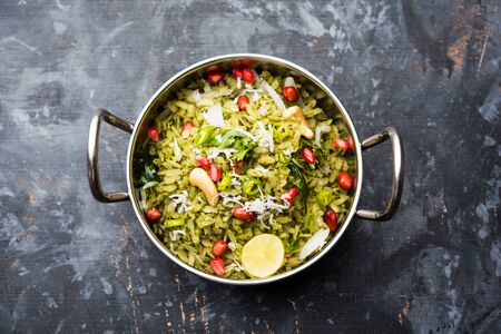 Hariyali Poha / Green Masala Pohe or flattened rice served in a bowl, selective focusの写真素材