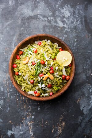 Hariyali Poha / Green Masala Pohe or flattened rice served in a bowl, selective focusの写真素材