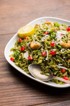 Hariyali Poha / Green Masala Pohe or flattened rice served in a bowl, selective focusの写真素材
