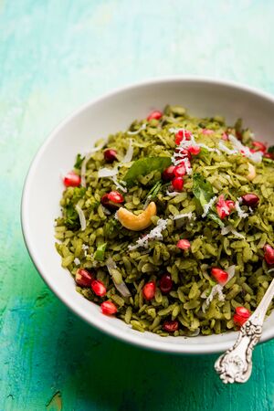 Hariyali Poha / Green Masala Pohe or flattened rice served in a bowl, selective focusの写真素材