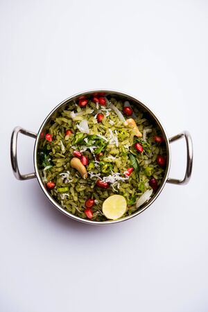 Hariyali Poha / Green Masala Pohe or flattened rice served in a bowl, selective focusの写真素材