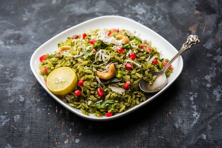 Hariyali Poha / Green Masala Pohe or flattened rice served in a bowl, selective focusの写真素材