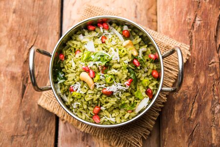 Hariyali Poha / Green Masala Pohe or flattened rice served in a bowl, selective focusの写真素材