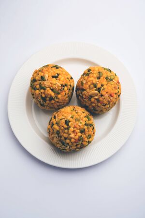 Jumbo Boondi Laddu mixed with dry fruits also know as laddoo/ ladoo/ laddo or Sweet dumplings made during festivals or weddingsの写真素材