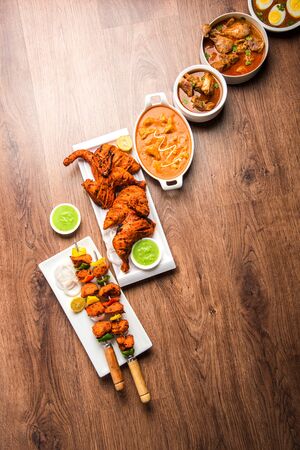 Assorted Indian Non Vegetarian food recipe served in a group. Includes Chicken Curry, Mutton Masala, Anda/egg curry, Butter chicken, biryani, tandoori murgh, chicken-tikka and naan/rotiの写真素材