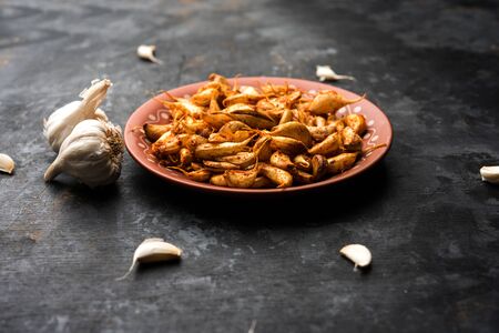 Garlic Fry or Tala Hua Lahsun in hindi, is a popular side dish or snacks from maharashtra, Indiaの写真素材