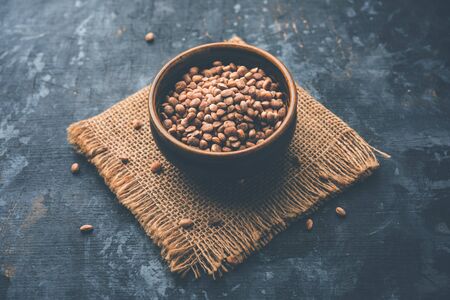 Indian charoli / charolya / Buchanania lanzan / Almondette kernel seeds in a bowl or pile. selective focusの写真素材