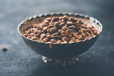 Indian charoli / charolya / Buchanania lanzan / Almondette kernel seeds in a bowl or pile. selective focusの写真素材