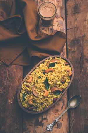 Jada Poha Namkeen Chivda / Thick Pohe Chiwda is a jar snack with a mix of sweet, salty and nuts flavours, served with tea. selective focusの写真素材