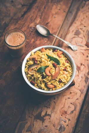Jada Poha Namkeen Chivda / Thick Pohe Chiwda is a jar snack with a mix of sweet, salty and nuts flavours, served with tea. selective focusの写真素材