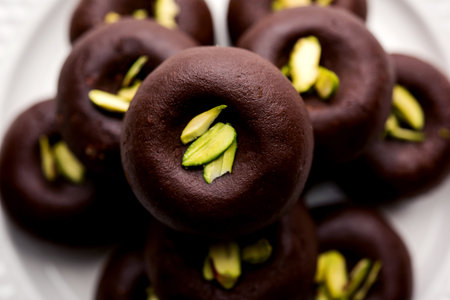 Chocolate Milk peda or pera or pedha made using sweet condensed Milk and cocoa powder, garnished...
