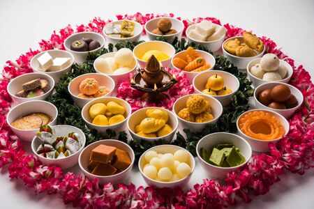 Rangoli of Assorted Indian sweets/mithai in bowl for Diwali or any other festivals, selective focusの写真素材