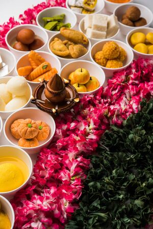 Rangoli of Assorted Indian sweets/mithai in bowl for Diwali or any other festivals, selective focusの写真素材