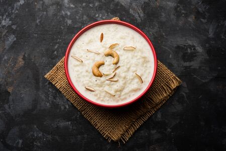 Rice Kheer or Firni or Chawal ki Khir is a pudding from Indian subcontinent, made by boiling milk, sugar and rice. Served in a bowlの写真素材