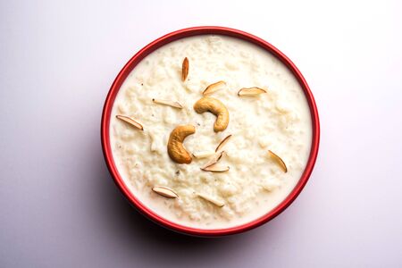 Rice Kheer or Firni or Chawal ki Khir is a pudding from Indian subcontinent, made by boiling milk, sugar and rice. Served in a bowlの写真素材