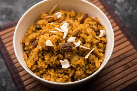 Wheat Laapsi/Lapsi/Shira/Halwa is an Indian sweet dish made of broken wheat or Daliya pieces and...