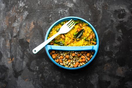 Lunch Box / Tiffin for Indian kids, hot Poha made using beaten rice and spices, accompanied with sproutsの写真素材