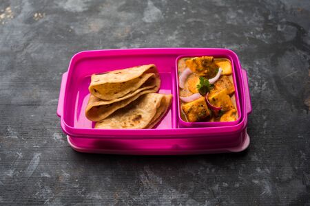 Paneer Butter Masala with Roti in lunch box or tiffin, selective focusの写真素材