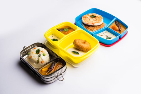 Assorted South Indian tiffin / lunch box food in group, includes idli vada, uttapam/uthappam, upma...