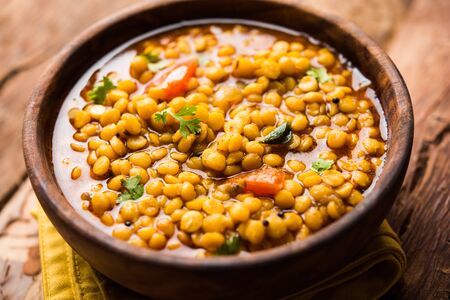 cooked Chana Dal fry or Split Bengal Gram tadka served in a bowl or pan, selective focusの写真素材