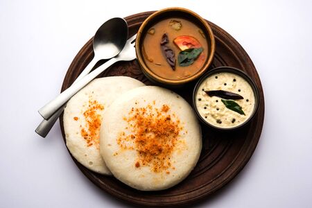 Thatte or Taste Idli also known as Plate Idly is a Popular south Indian Food, served with sambar and chutney.の写真素材