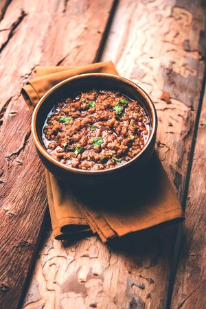 Kheema / keema Pav or Khima Paav is a spicy curry dish made up of minced chicken or lamb cooked with onion and tomatoesの写真素材