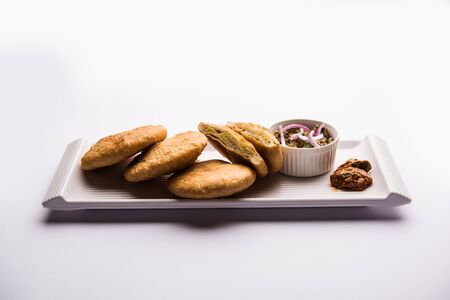 Fried Sattu Litti chokha served with Baingan Bharta, onion and pickle, popular recipe from Bihar, Indiaの写真素材