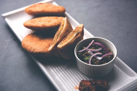 Fried Sattu Litti chokha served with Baingan Bharta, onion and pickle, popular recipe from Bihar, Indiaの写真素材