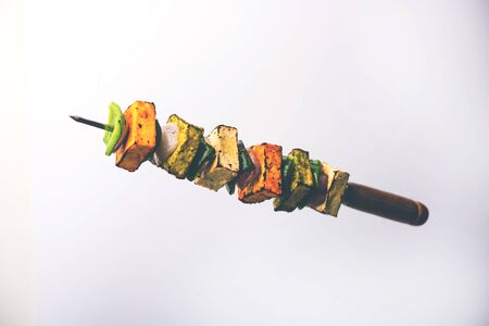 Food  Levitation - Flying Paneer Tikka isolated over white or black background, selective focusの写真素材
