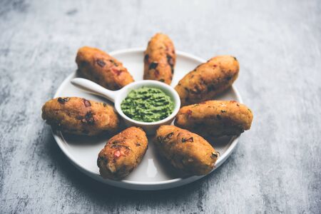 Veg Poha Roll made using flattened rice, served with  green chutneyの写真素材