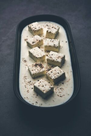 Paneer Dum Kali Mirch / Kalimirch, prepared in a white creamy gravy and black pepper powder sprinkled over it. served in a bowl. Selective focusの写真素材